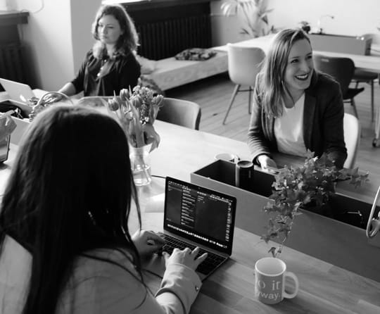 Women talk in a meeting