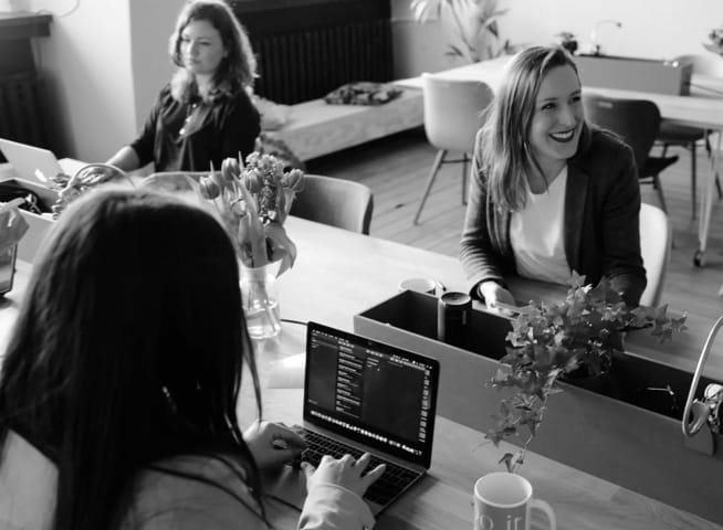 Women talk in a meeting